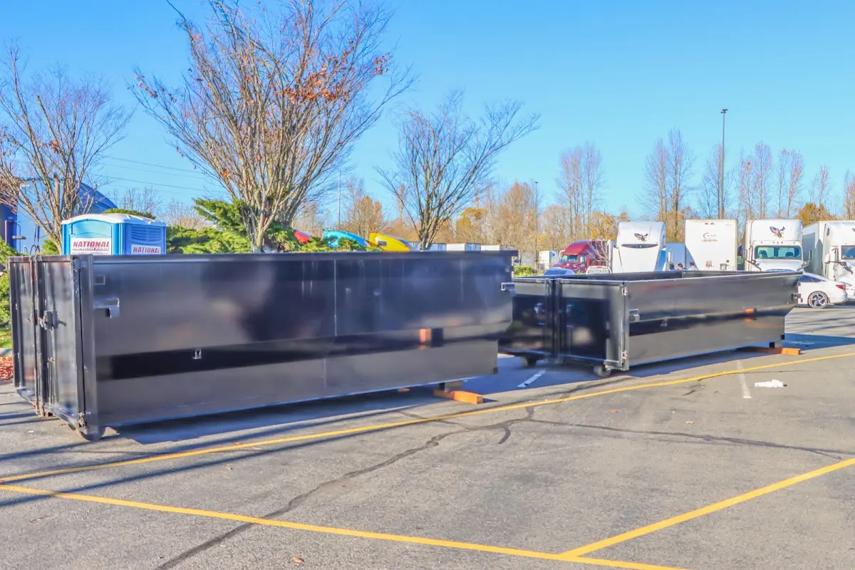 Professional dumpster rental service with roll-off container on residential driveway in Inverness Highlands South
